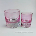 Thick base colored glass candle holder with water drop design